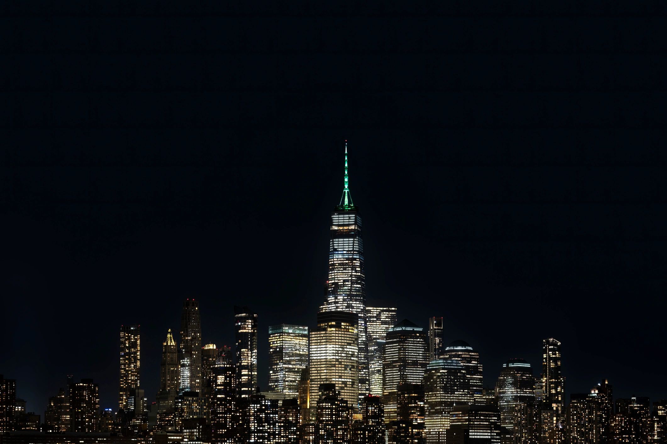 New York City skyline glowing at night during the holiday season